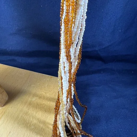 Beaded Keychain Bag Charm With Orange & White Tassels And Silver Floral Accent - Picture 3 of 4